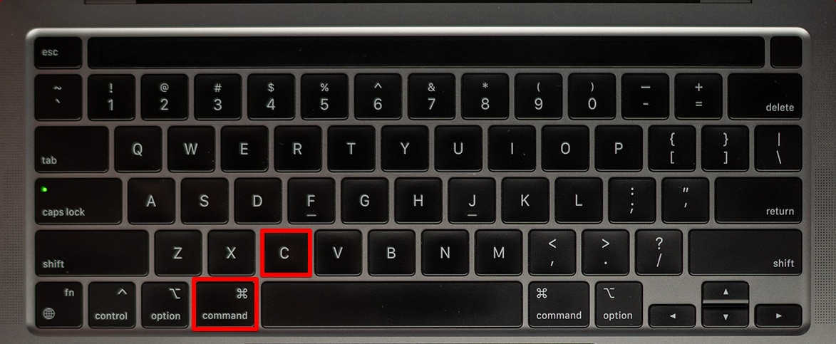 Pressing the Command+C keys on a keyboard.
