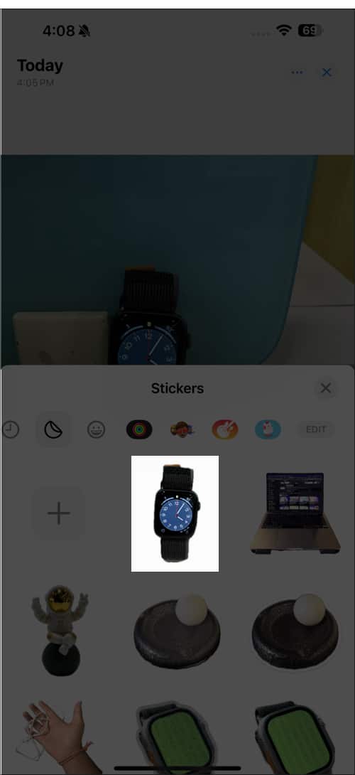 Using the extracted subject as a sticker on the iPhone.