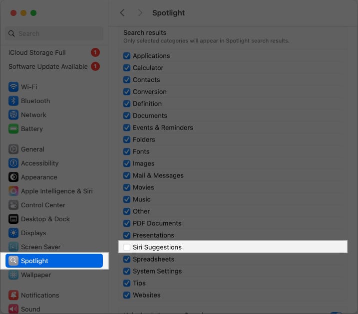 Deselecting the Siri Suggestions option for Spotlight on a Mac.