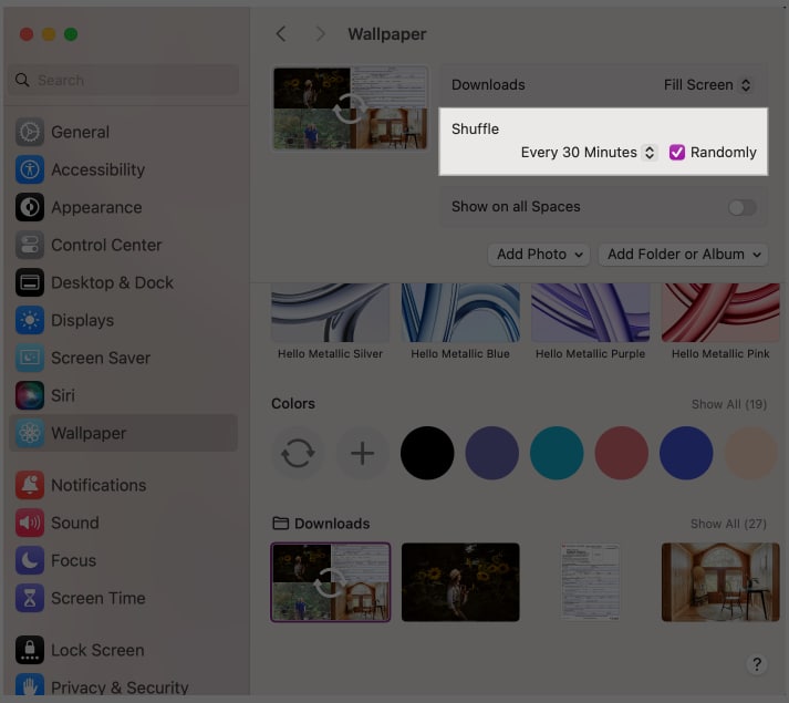 Enabling the Shuffle option for live wallpapers in the macOS System Settings app.