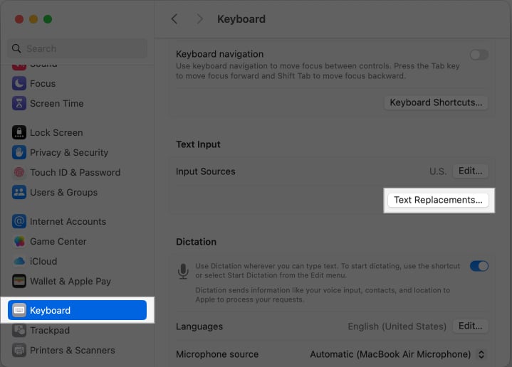 Accessing the Text Replacement feature in macOS System Settings.