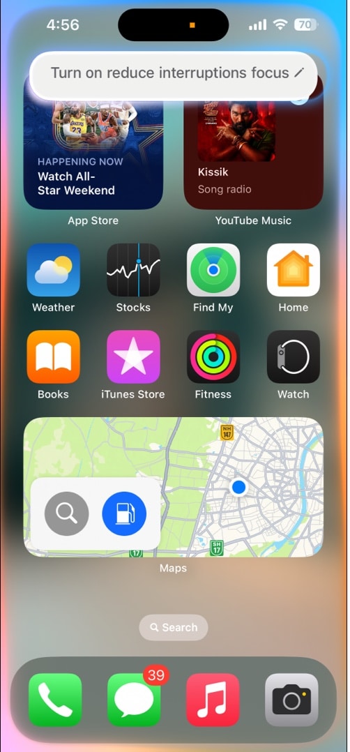 Asking Siri to enable the Reduce Interruptions Focus on an iPhone.