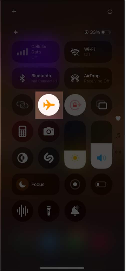 Putting an iPhone into Airplane Mode from the Control Center.