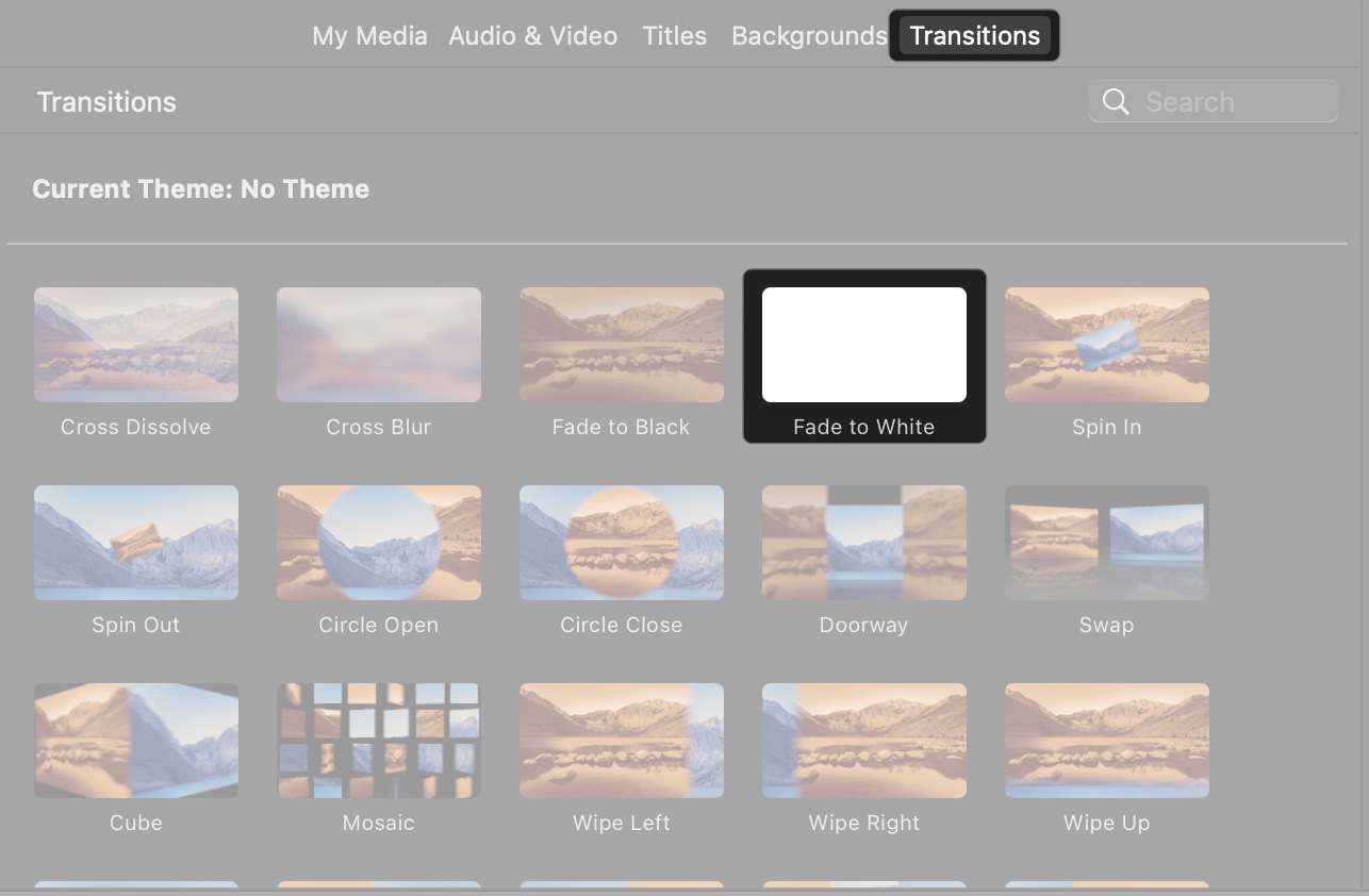 Click transitions in media liabriary and drag between clips on imovie in mac
