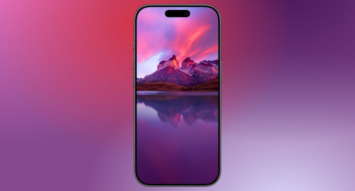 Pink mountain reflection on lake