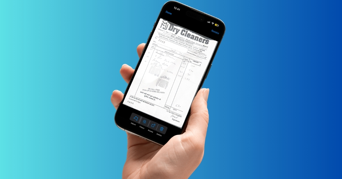 Hand holding a smartphone displaying a receipt or invoice on the screen against a blue background.