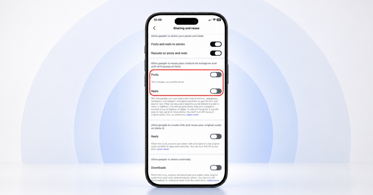 iPhone on a white surface showing the Instagram Sharing and reuse settings, with toggles for Posts and Reels.