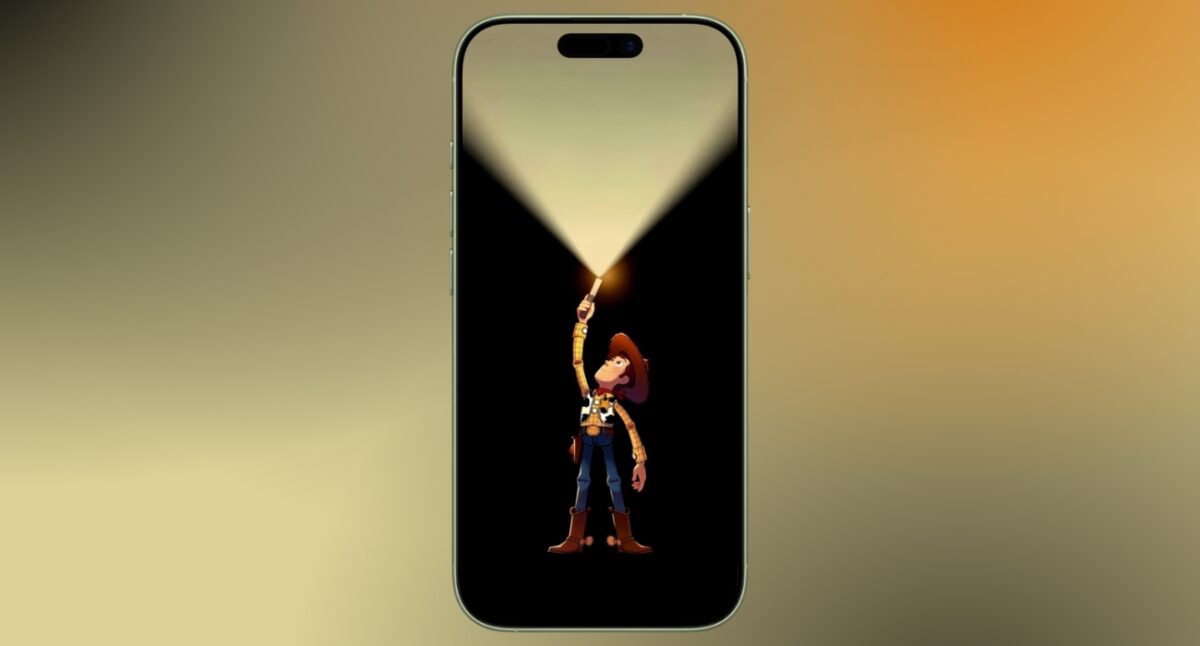 Woody in the dark holding a torch