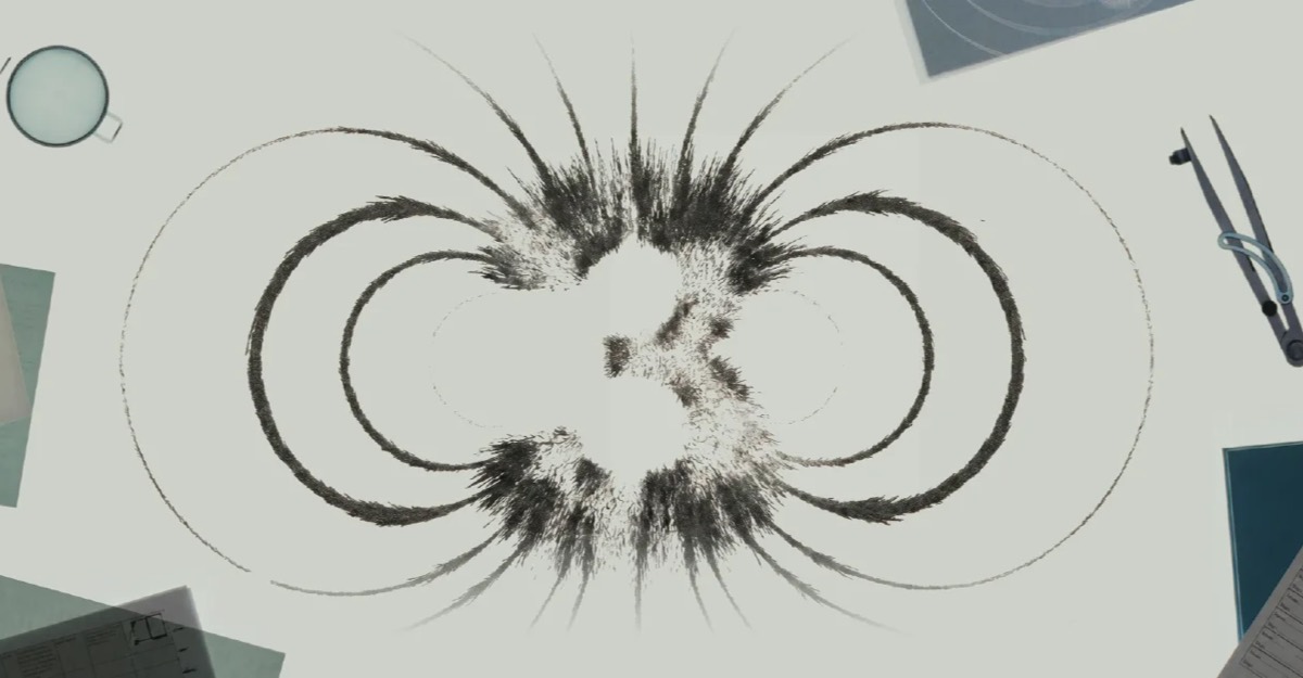 Kimi K3 logo drawn with magnetic particles on a white surface