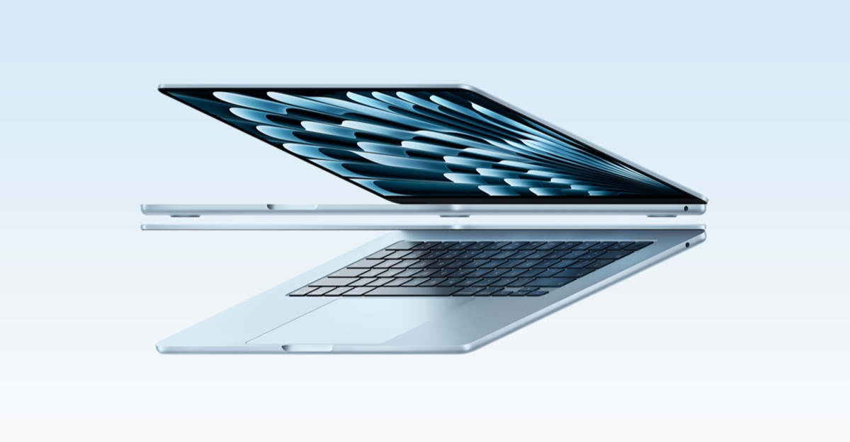 Slim silver laptop opened at an angle, floating mid-air against a pale blue gradient background.