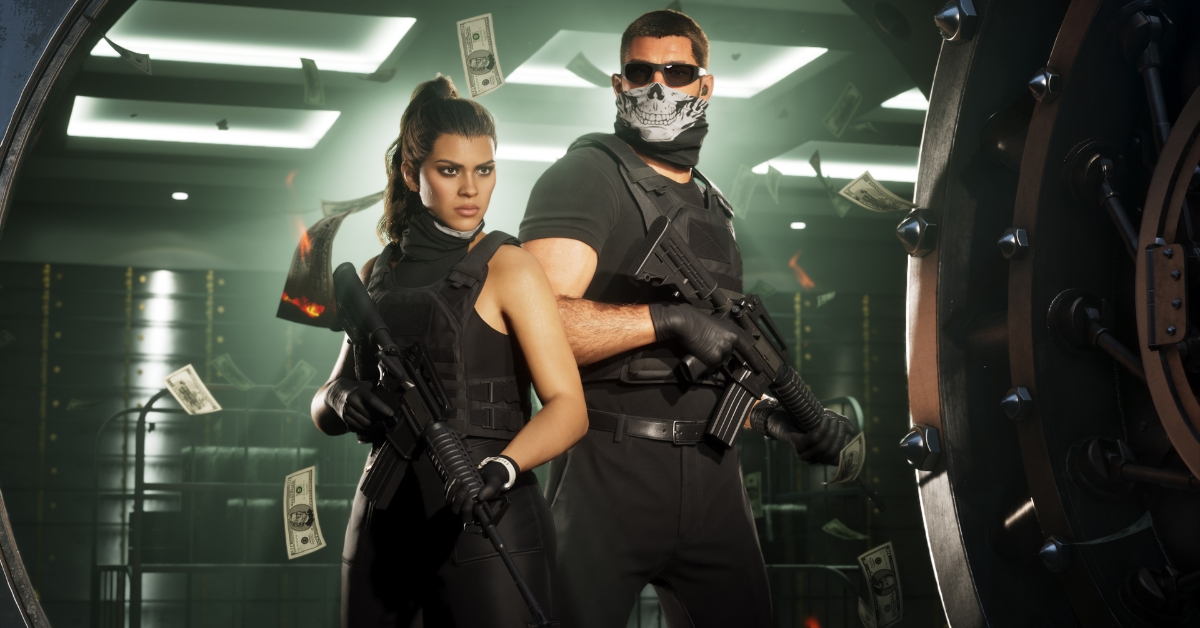 Two armed operatives stand in a bank vault with money fluttering around them