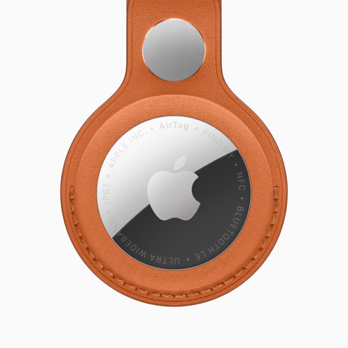 Apple AirTag with FineWoven Key Ring, shown as a size reference for the rumored AI pendant