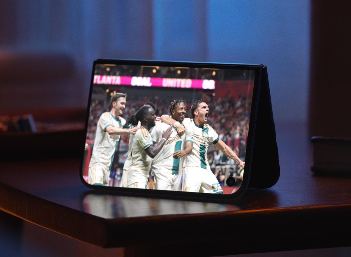 iPhone Duo: Everything You Need to Know About Apple’s First Foldable iPhone – iGeeksBlog iPhone Duo standing on a table while showing a sports match