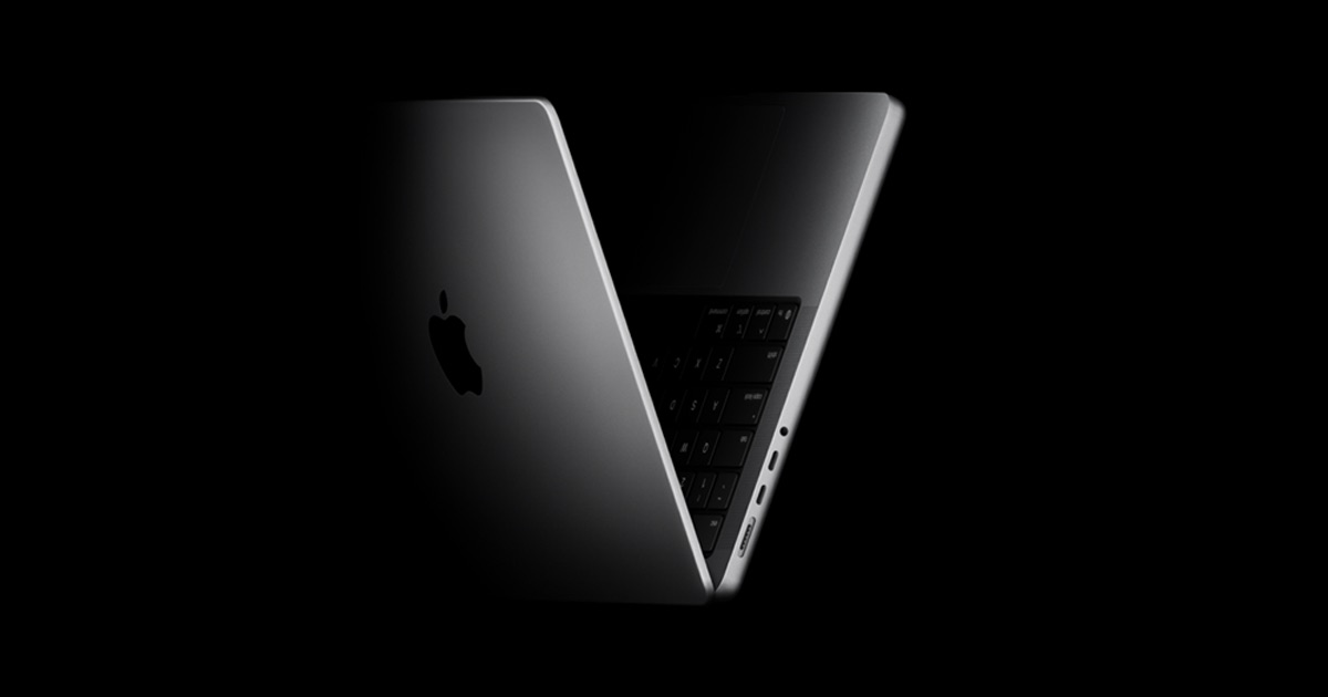 Apple MacBook Pro shown open at an angle as context for the rumored OLED MacBook tier
