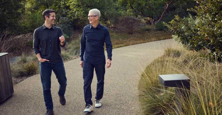 Tim Cook and John Ternus walking together at Apple Park