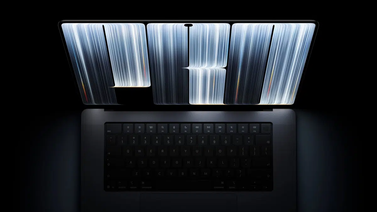 Open laptop viewed from above, with large glowing letters forming 'FW' hovering over the keyboard.